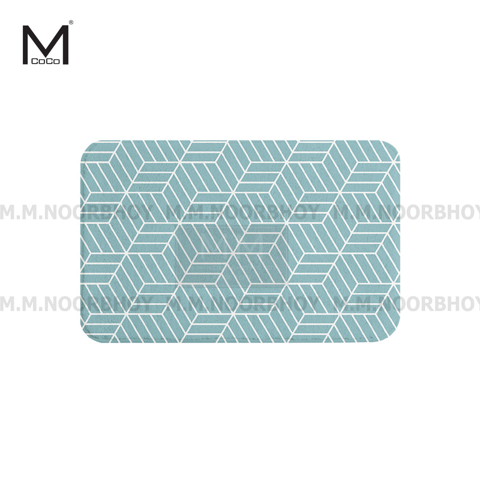 A rectangular printed bathroom floor mat with a geometric pattern in light sea green and white colors
